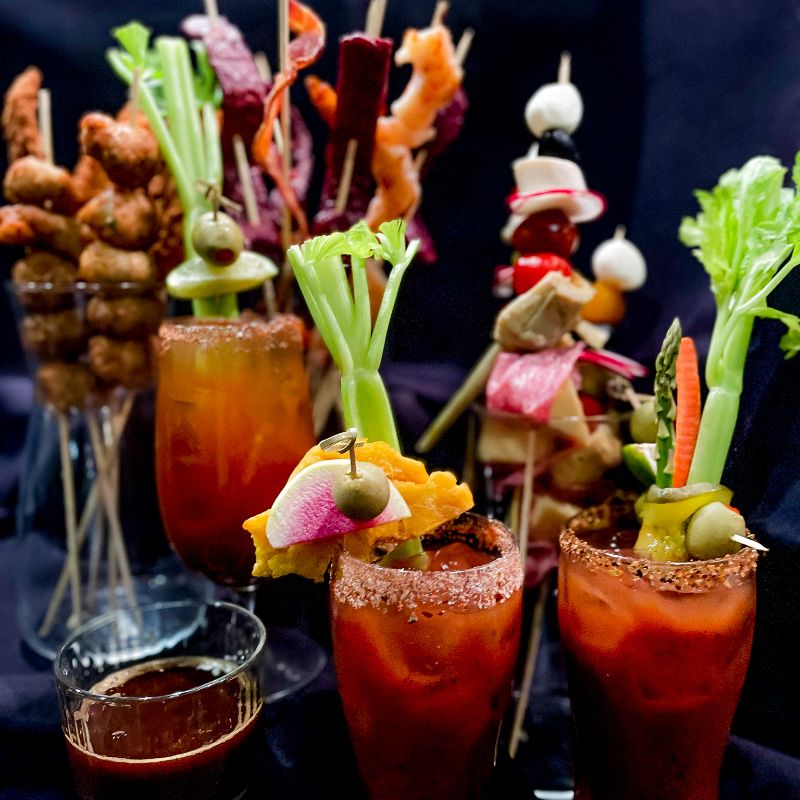 three women entrepreneurs uplifting one another at a networking event.